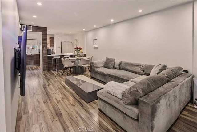 living room with light hardwood / wood-style flooring