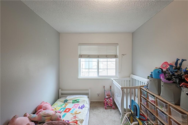 carpeted bedroom featuring a textured ceiling