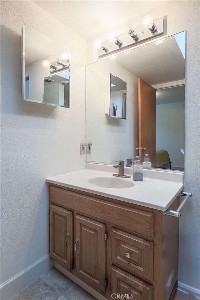 bathroom with vanity and tile patterned floors