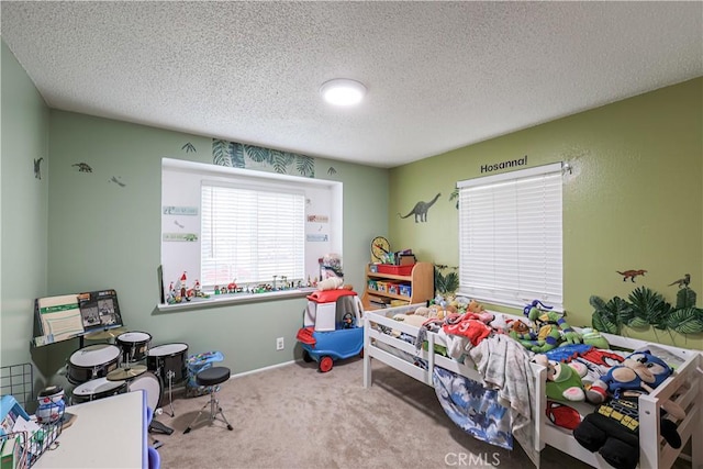 bedroom featuring a textured ceiling and carpet