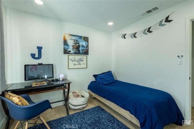 bedroom featuring hardwood / wood-style flooring