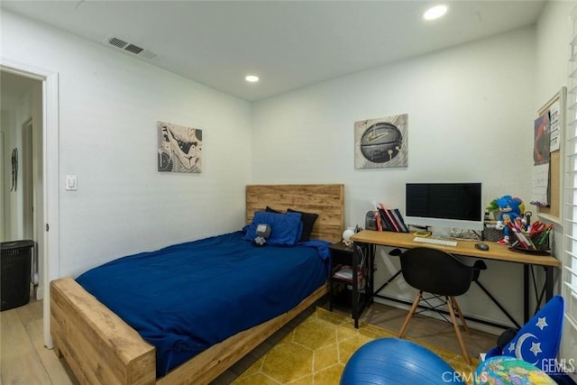 bedroom featuring hardwood / wood-style floors