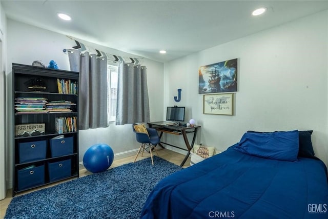 bedroom featuring wood-type flooring