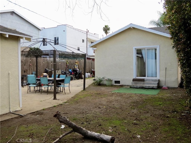 rear view of house featuring a patio