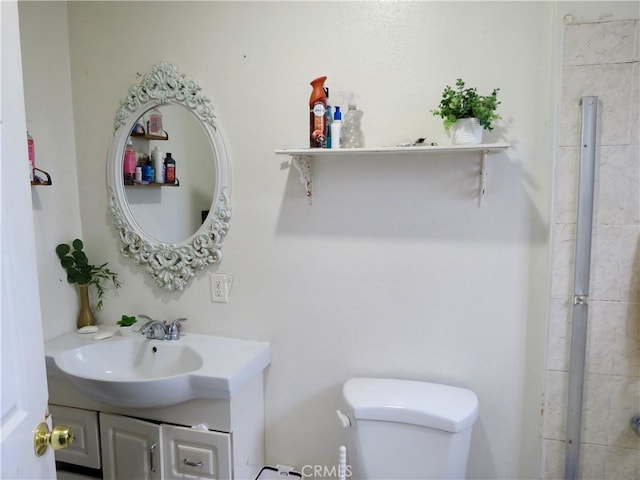 bathroom with vanity and toilet