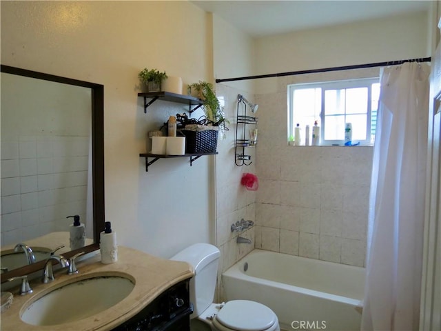 full bathroom featuring shower / bathtub combination with curtain, vanity, and toilet