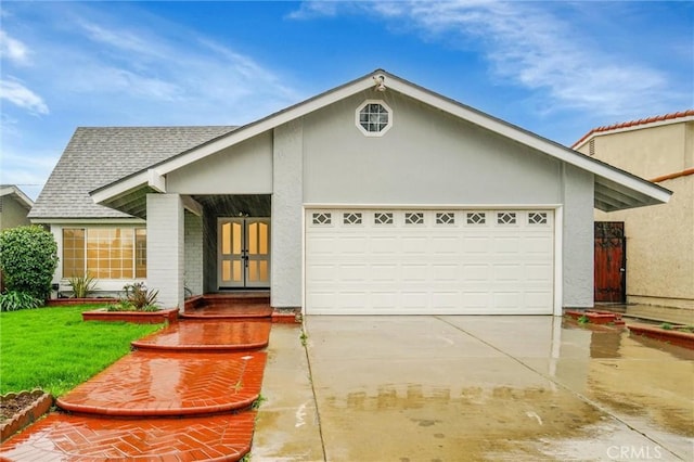 ranch-style home featuring a garage