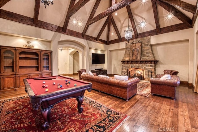 22931 Sonriente Trl, Coto De Caza, CA 92679 - playroom with high vaulted ceiling, arched walkways, wood-type flooring, beam ceiling, and billiards