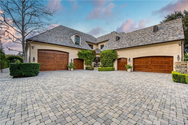 22931 Sonriente Trl, Coto De Caza, CA 92679 - french country home with stucco siding, a high end roof, an attached garage, and driveway