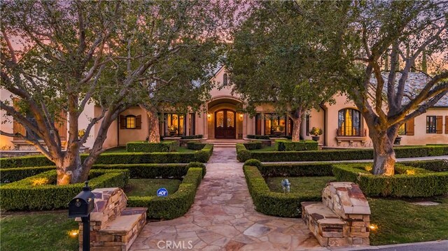 22931 Sonriente Trl, Coto De Caza, CA 92679 - view of front of property with french doors and stucco siding