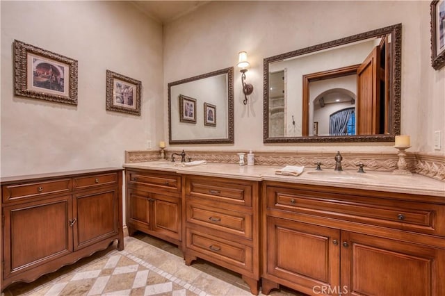 22931 Sonriente Trl, Coto De Caza, CA 92679 - bathroom with double vanity, inlaid floor details, and tile patterned floors