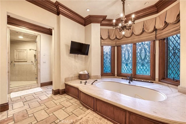 22931 Sonriente Trl, Coto De Caza, CA 92679 - bathroom featuring ornamental molding, baseboards, a bath, a chandelier, and a stall shower