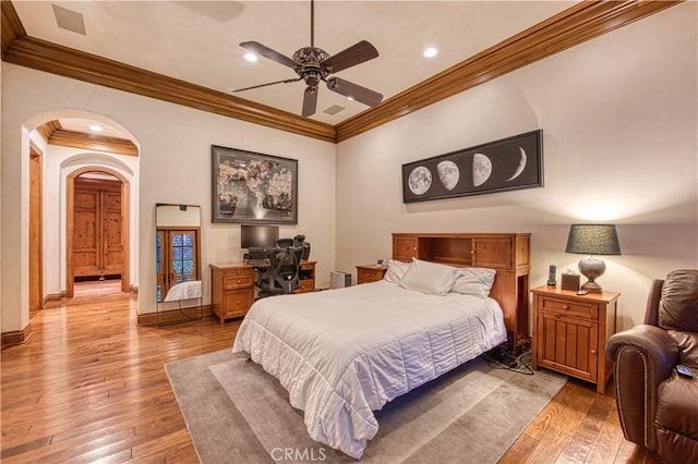 22931 Sonriente Trl, Coto De Caza, CA 92679 - bedroom with ornamental molding, light wood-type flooring, arched walkways, recessed lighting, and a ceiling fan