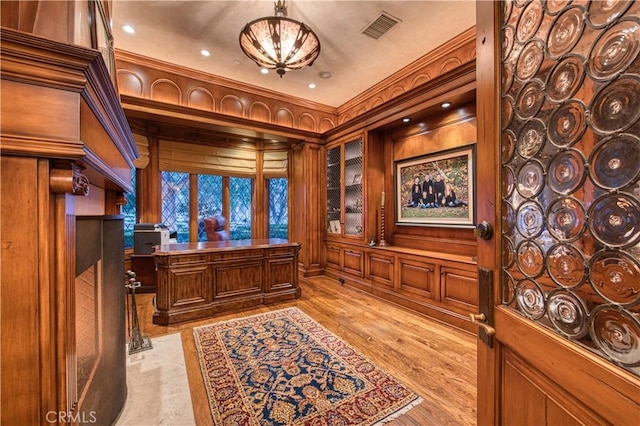 22931 Sonriente Trl, Coto De Caza, CA 92679 - office space with wooden walls, light wood-style floors, recessed lighting, and crown molding