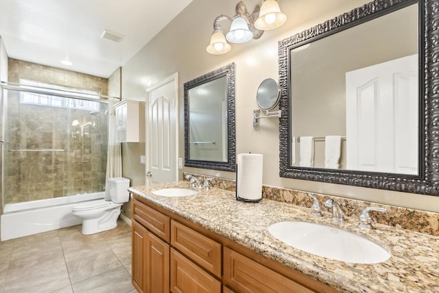 bathroom with visible vents, a sink, toilet, and shower / bathtub combination