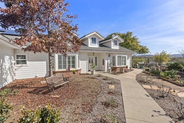 view of front of house featuring fence