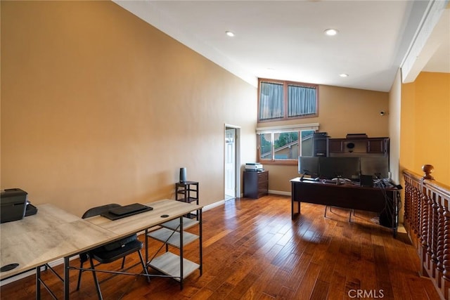 office area with hardwood / wood-style floors and vaulted ceiling