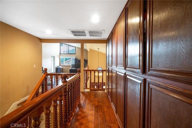 hallway with dark wood-type flooring