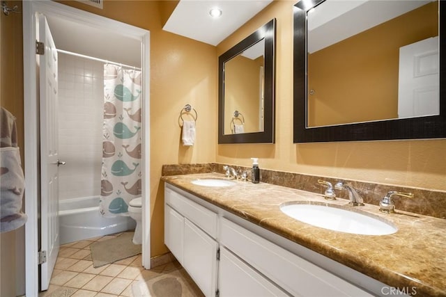 full bathroom featuring tile patterned flooring, shower / bath combo, vanity, and toilet