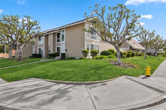 exterior space featuring a front lawn