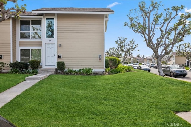 view of front of home featuring a front yard