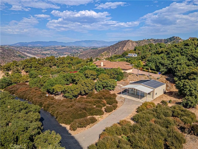 birds eye view of property featuring a mountain view