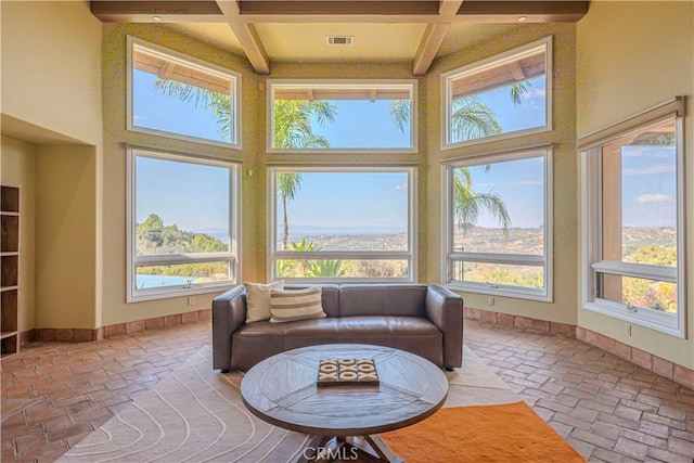 sunroom / solarium with coffered ceiling and beam ceiling