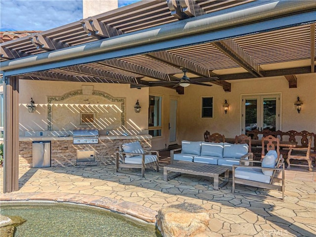 view of patio featuring an outdoor living space, a pergola, exterior kitchen, and a grill