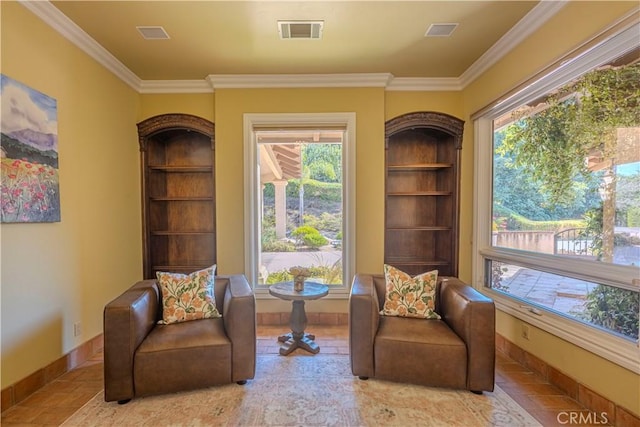 living area featuring ornamental molding and built in shelves