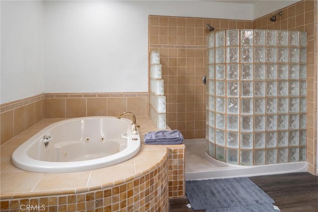 bathroom featuring separate shower and tub and hardwood / wood-style floors