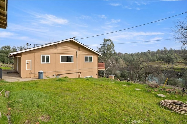 view of property exterior with a lawn