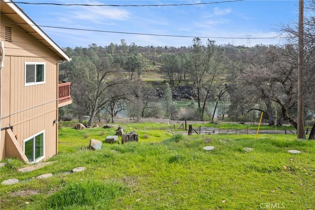 view of yard featuring a balcony