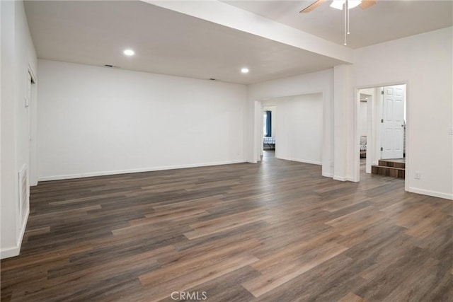 empty room with dark hardwood / wood-style floors and ceiling fan