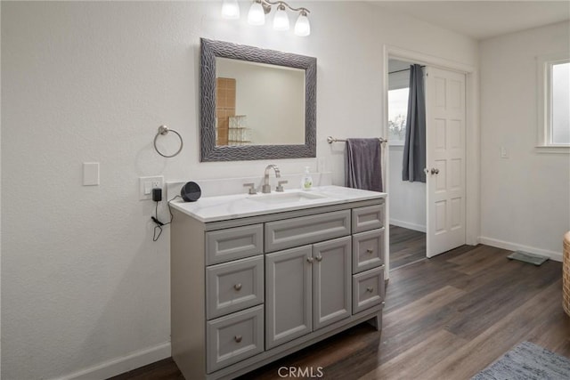 bathroom featuring vanity and wood-type flooring