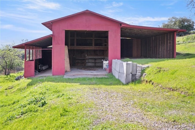 view of outdoor structure with a lawn