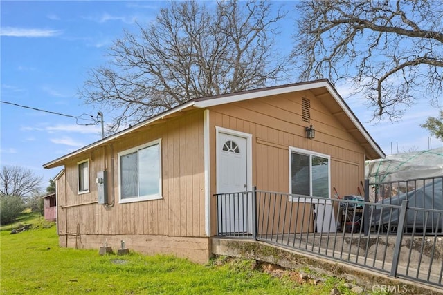 view of outbuilding with a yard