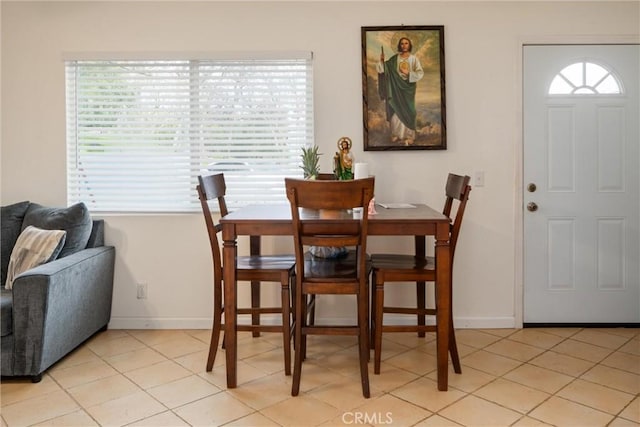 dining area with light tile patterned flooring