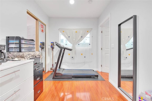 workout room with hardwood / wood-style flooring