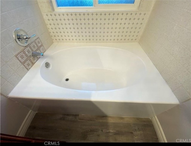 bathroom featuring a washtub