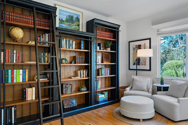 sitting room with hardwood / wood-style flooring