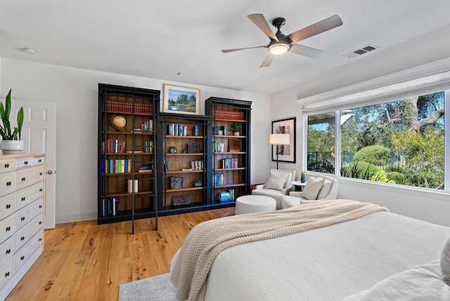 bedroom with light hardwood / wood-style flooring and ceiling fan