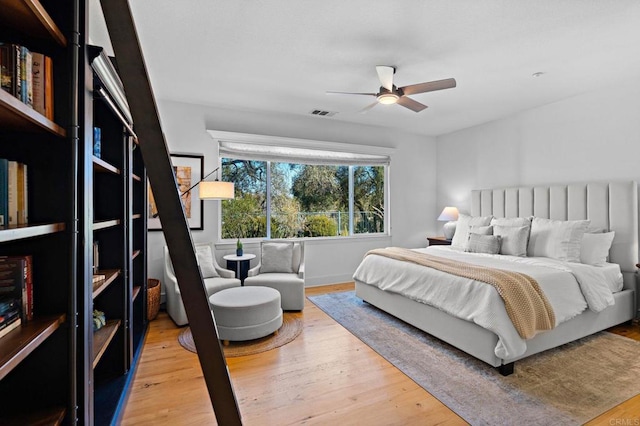 bedroom with wood-type flooring and ceiling fan