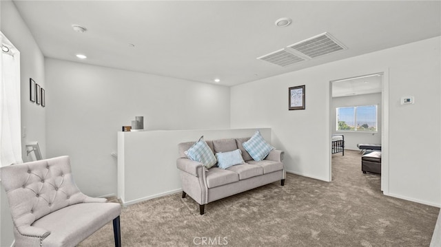 living area featuring light colored carpet