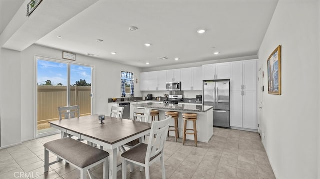 13180 Mesa Ln, Yucaipa, CA 92399 - dining area with recessed lighting, light tile patterned flooring, and baseboards