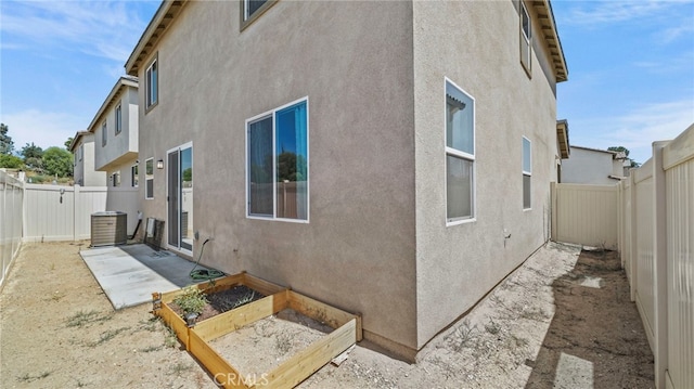 13180 Mesa Ln, Yucaipa, CA 92399 - rear view of house with a garden, a fenced backyard, and stucco siding