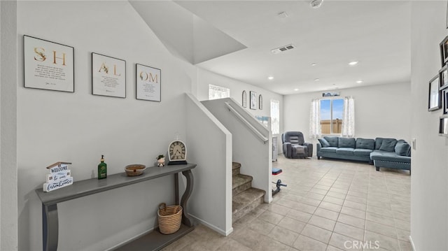 stairway with tile patterned flooring