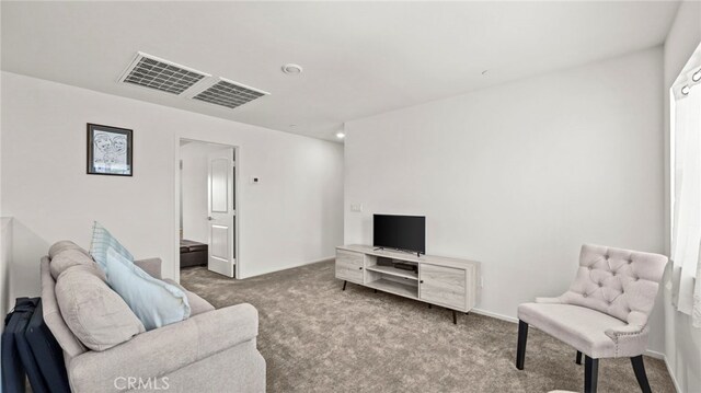 13180 Mesa Ln, Yucaipa, CA 92399 - carpeted living area with baseboards