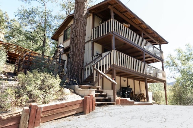 view of side of home with a balcony