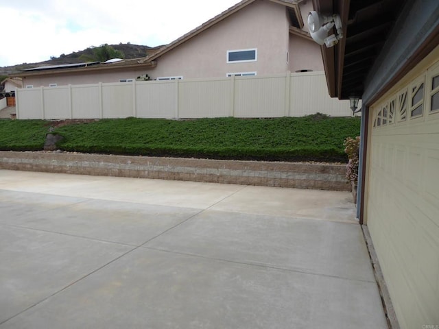 view of property exterior with a patio