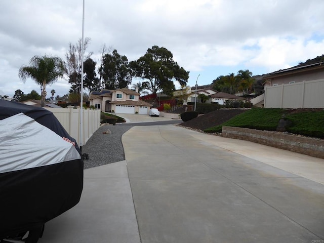 view of road featuring street lighting and a residential view